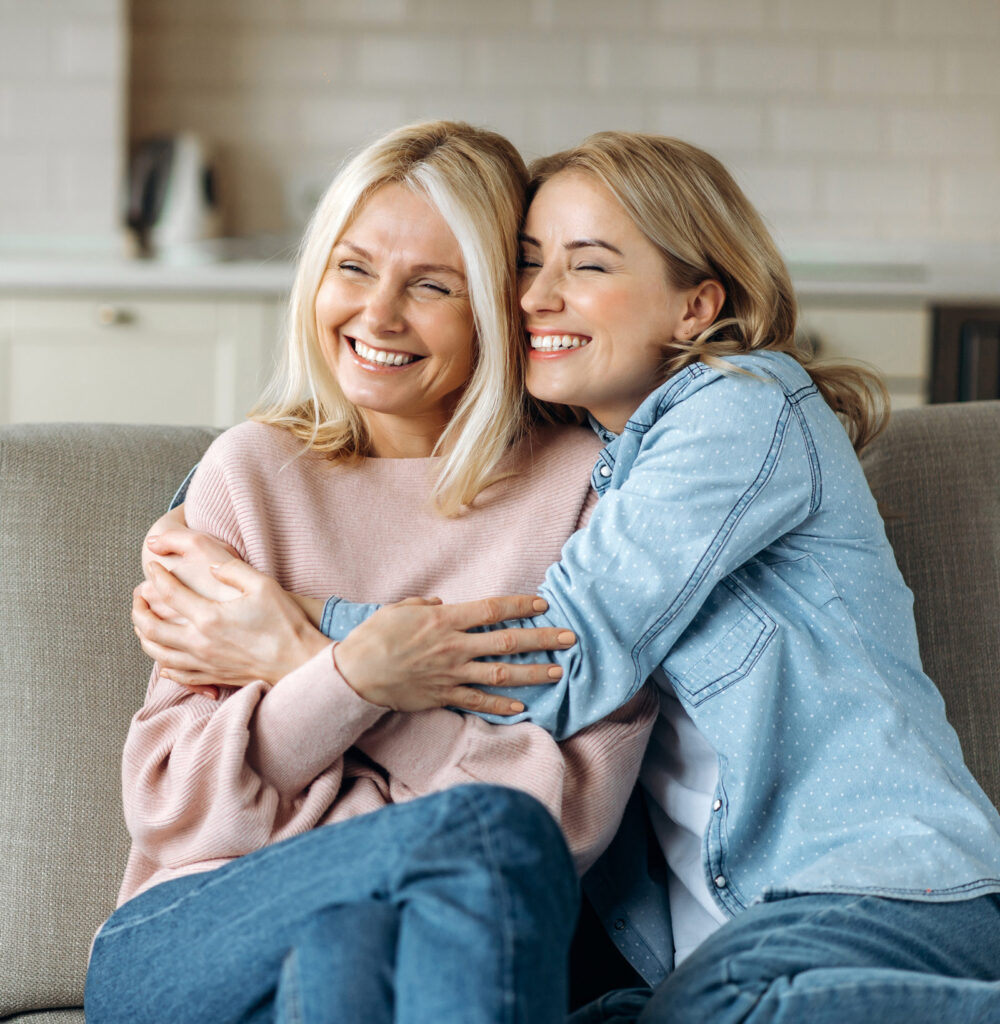 two women smiling and hugging, the woman's clinic, Gynecology at all stages of life