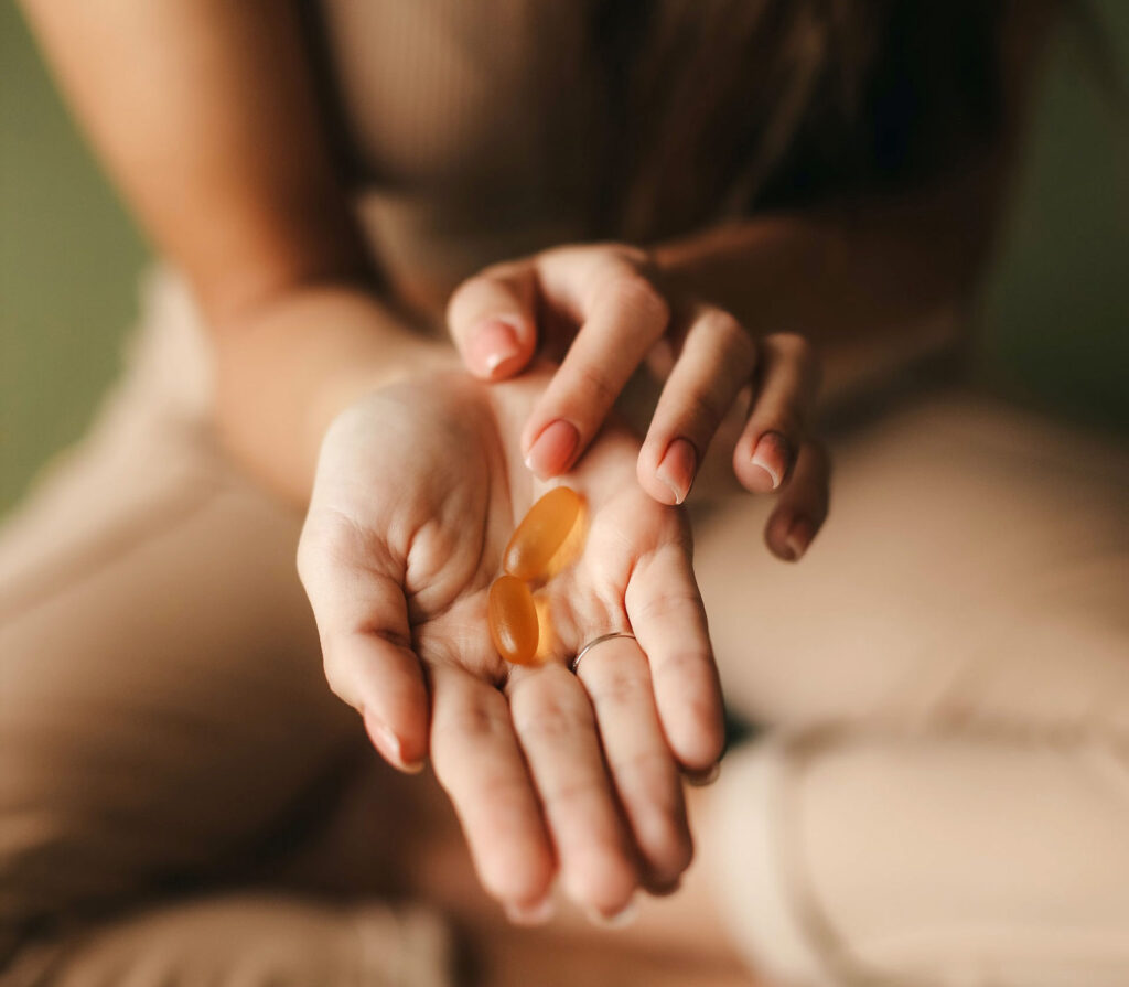 woman holding vitamins